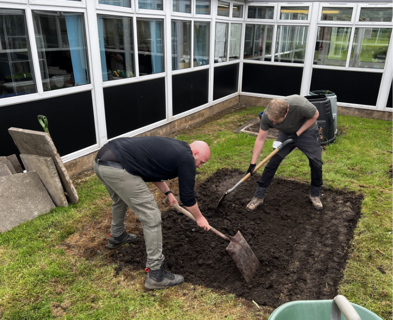 , Findel lends a hand (and a shovel) at Corrie Primary School
